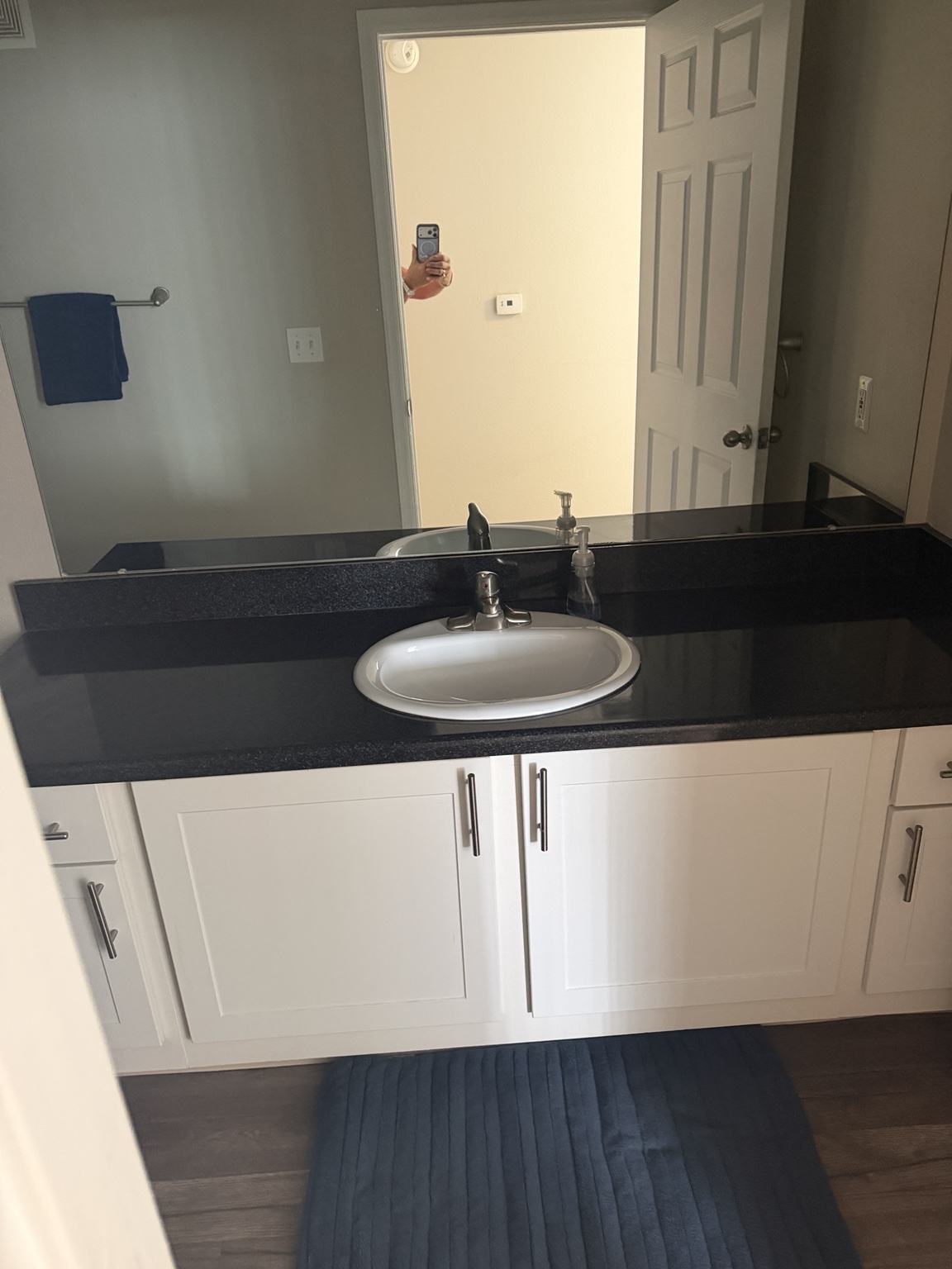 After: another view of the clean vanity and mirror