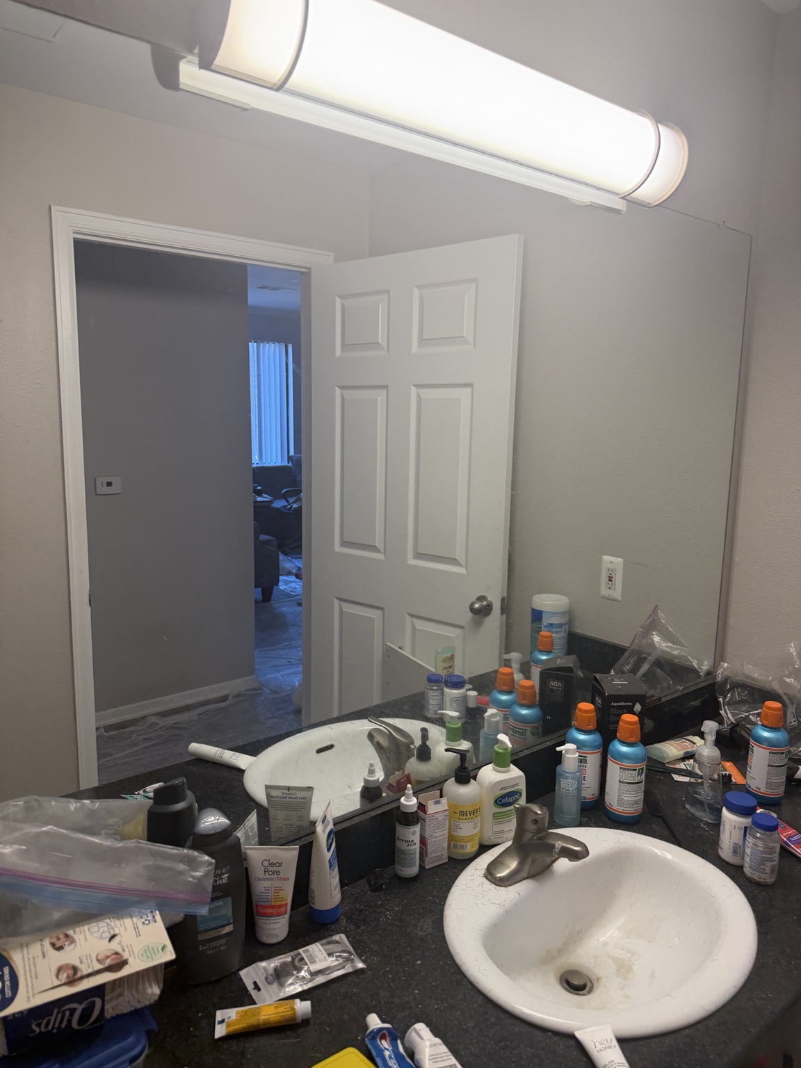 Before: another view of the crowded vanity and mirror