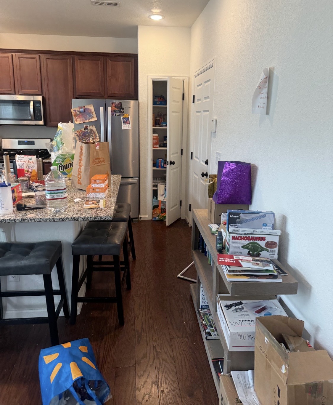 Before: clutter beside the kitchen island and pantry
