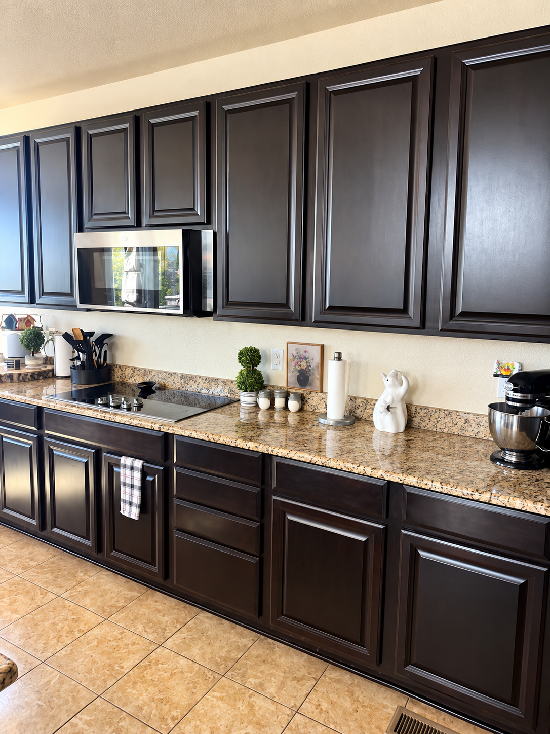 After: cleared counters and dark kitchen cabinets
